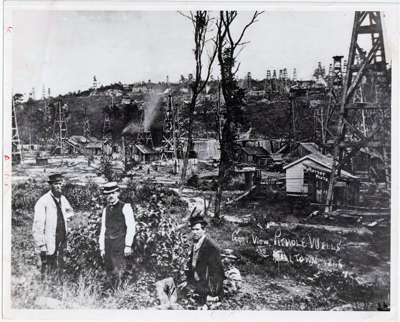 A view of Balltown. Note the town of Pithole on the “wooded bluff” in the background